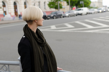 Fototapeta premium Young blonde woman walking in the city