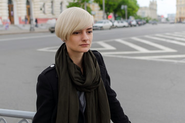 Fototapeta premium Young blonde girl walking on the city