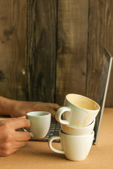 Obraz na płótnie Canvas Many cups of coffee with laptop 
