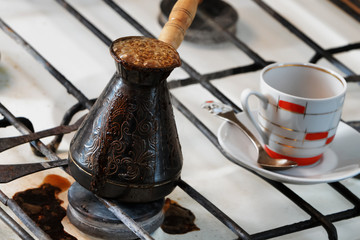 Coffee brewed in a coffee maker on an old plate.