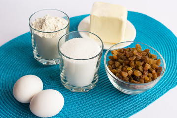 set of products for cooking muffins on the blue napkin