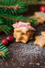 Christmas gingerbread cookies with festive decoration on old rustic background, selective focus. Holiday concept