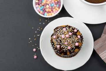 Chocolate muffin and cup of coffee, top view