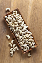 Cashews in old wooden dish