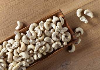 Cashews in old wooden dish