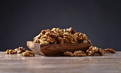 Walnuts in old wooden dish