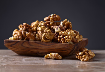 Walnuts in old wooden dish