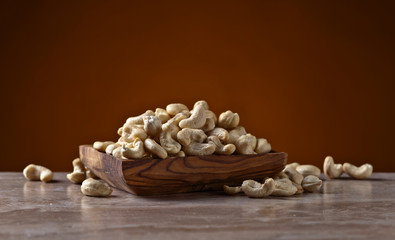Cashews in old wooden dish