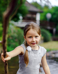 Cute little girl outdoor portrait on the river