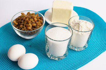 set of products for cooking muffins on the blue napkin