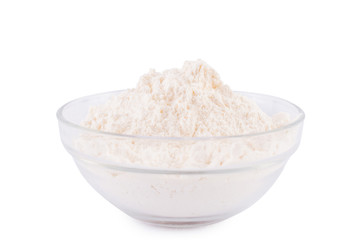 Flour in a glass bowl. On white, isolated background.