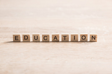 wooden elements with the letters collected in the word education