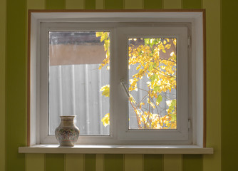 bedroom window, vase, view of the street with trees