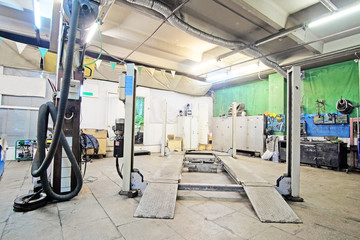 Car under repair in a car repair station