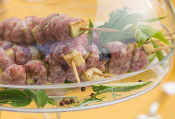 Detail of raw meat skewers ready for cooking