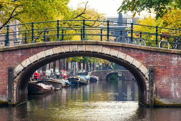 City view of Amsterdam with bridges and bicycles in the Netherlands