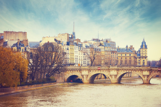 Pont Neuf in central Paris, France.  The Pont Neuf  is the oldest standing bridge across the river Seine in Paris. Toned image