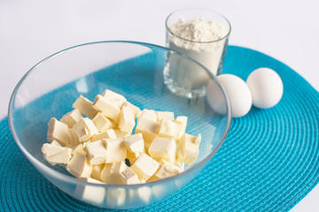 set of products for cooking muffins on the blue napkin