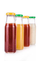 Bottled sauces. On white, isolated background.