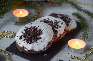 Christmas and New Year composition. Christmas cookies, candles, fir branches. Flat plan, side view