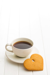 Gingerbread heart shape and coffee mug.