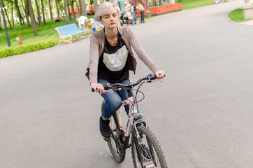 Fototapeta premium Young girl with a bicycle