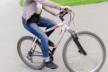 Naklejka premium Young girl with a bicycle