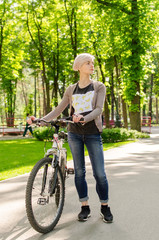 Young girl with a bicycle