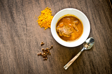 cup of steaming hot soup with spices