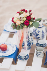 bouquet on decorated table for romantic date in the evening