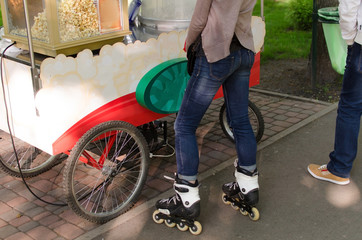 Obraz premium Young girl with rollers in the park