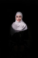 Portrait Of Muslim Girl Isolated in Dark