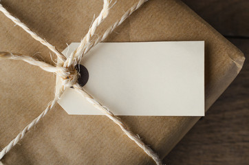 Close Up of Blank Tag on String Tied Parcel