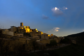 A sunset skyline of an old spanish town. Golden walls. 