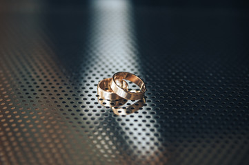 wedding Rings on a perforated metal