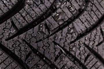 Winter tyre close-up with water drops