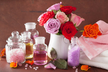 Obraz na płótnie Canvas spa aromatherapy with rose flowers essential oil salt