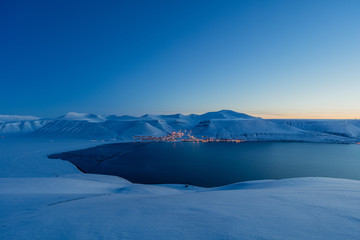 Worlds northernmost town - Longyearbyen in blue light - obrazy, fototapety, plakaty