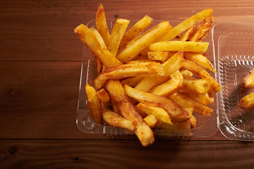 Fried potato chips in plastic packaging