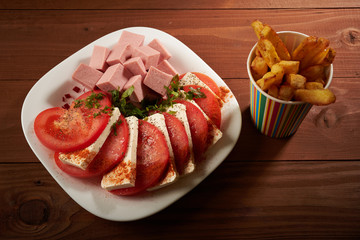 meat salad with tomato and cheese fries
