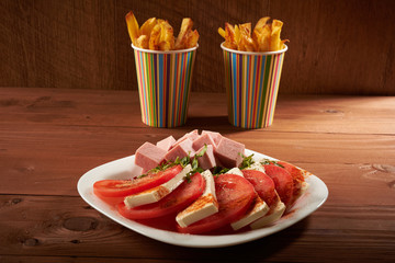 meat salad with tomato and cheese fries