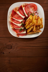salad with tomato and cheese fries