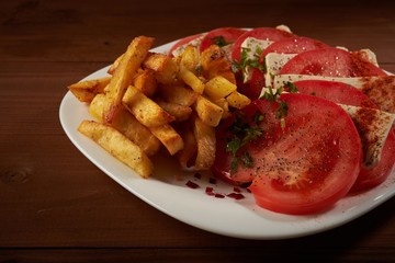 salad with tomato and cheese fries