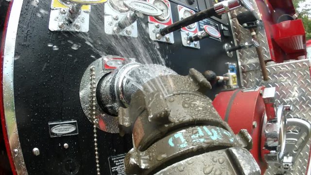 Leaking fire hose attatched to engine
