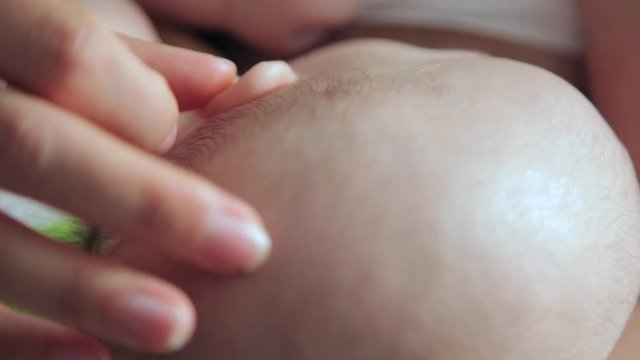 mom breastfeeding her little daughter