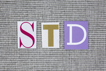 STD (Sexually Transmitted Infections) acronym on grey background