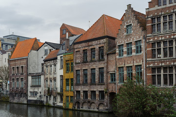 Fototapeta na wymiar Old buildings by canal in Gent, Belgium