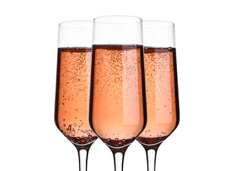 Glass of pink rose champagne with bubbles on white