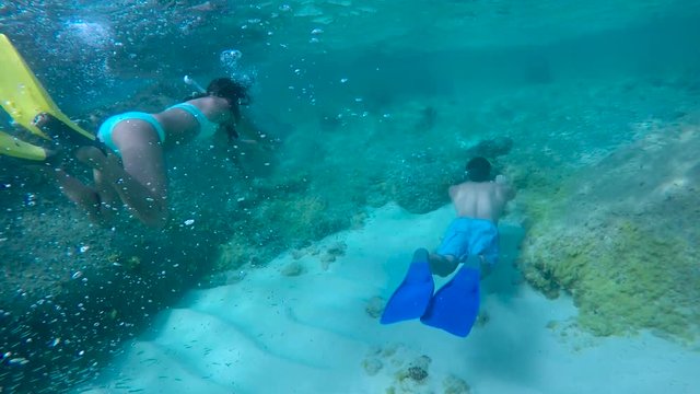 couple snorkeling underwater in Virgin Gorda, British Virgin Islands