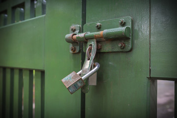 Selective focus of Lock on the gate, shadow vintage or retro style